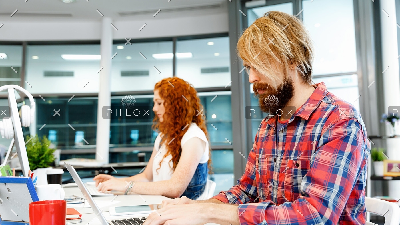 two-co-workers-working-together-PPVW2LA